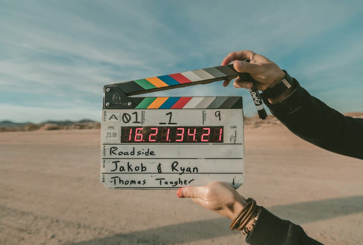 Film clapperboard held up outdoors